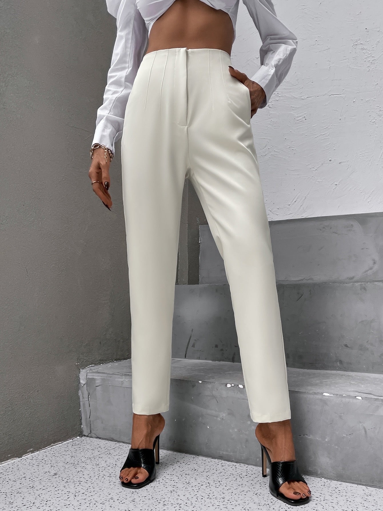 Pantalon élégant avec taille haute et fermeture éclair