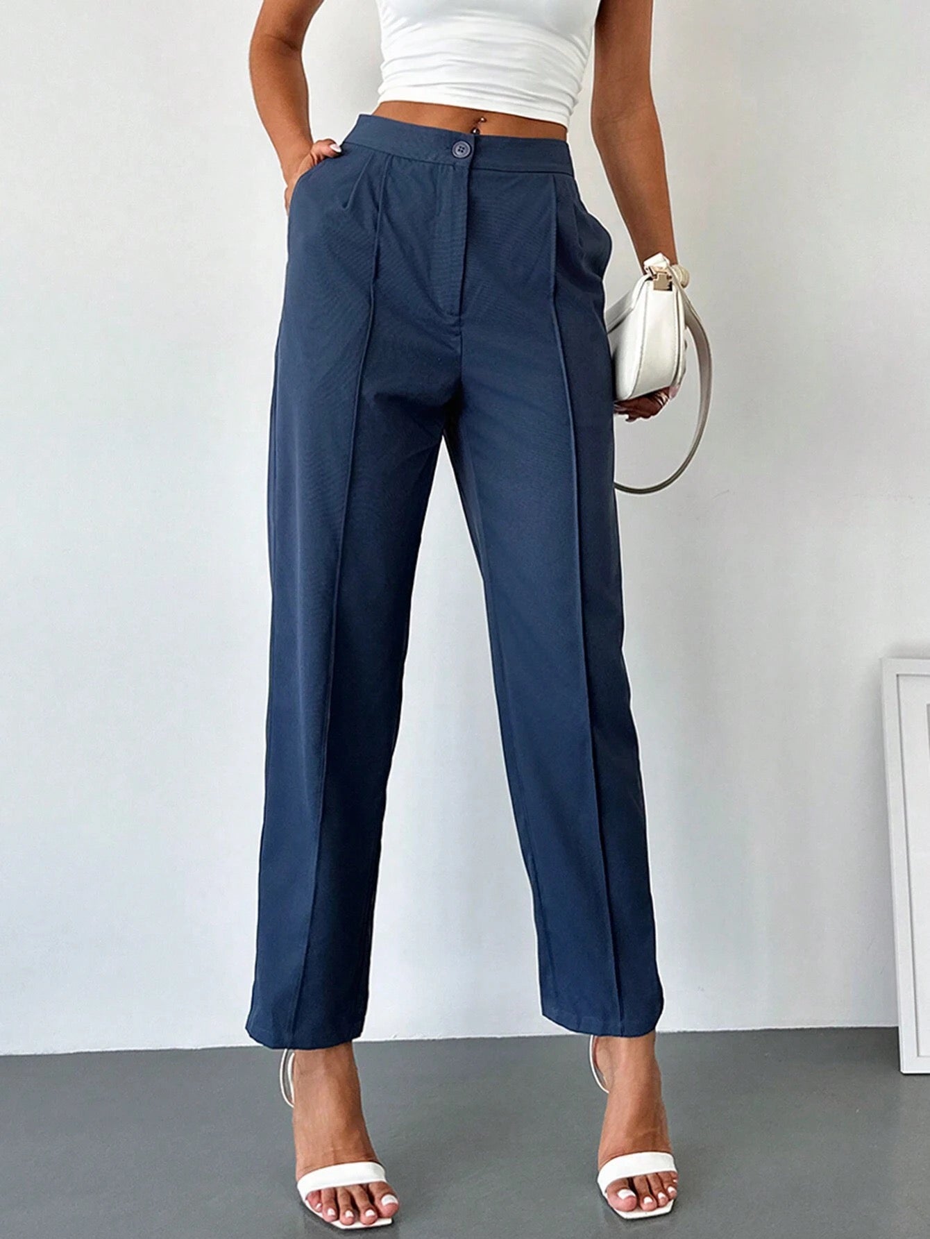 Pantalon élégant avec taille haute et poches