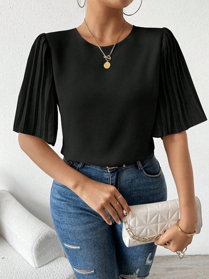 Blouse avec manches plissées et col rond