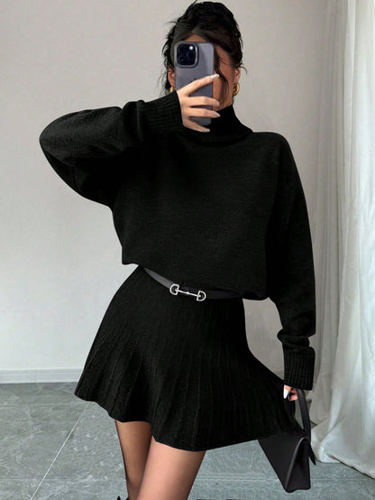 Ensemble pull à col roulé et jupe plissée