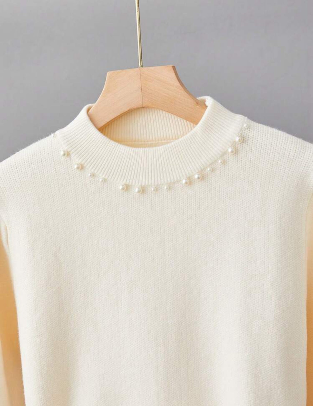 Pull élégant avec détails perles