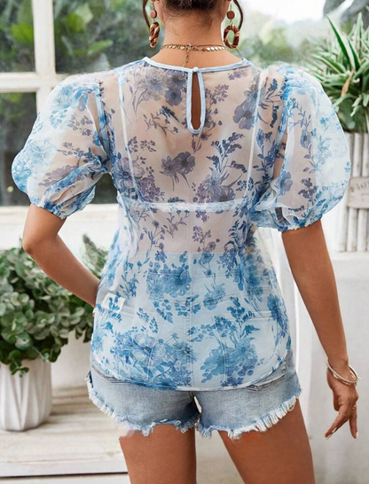 Blouse transparente avec motif fleuris