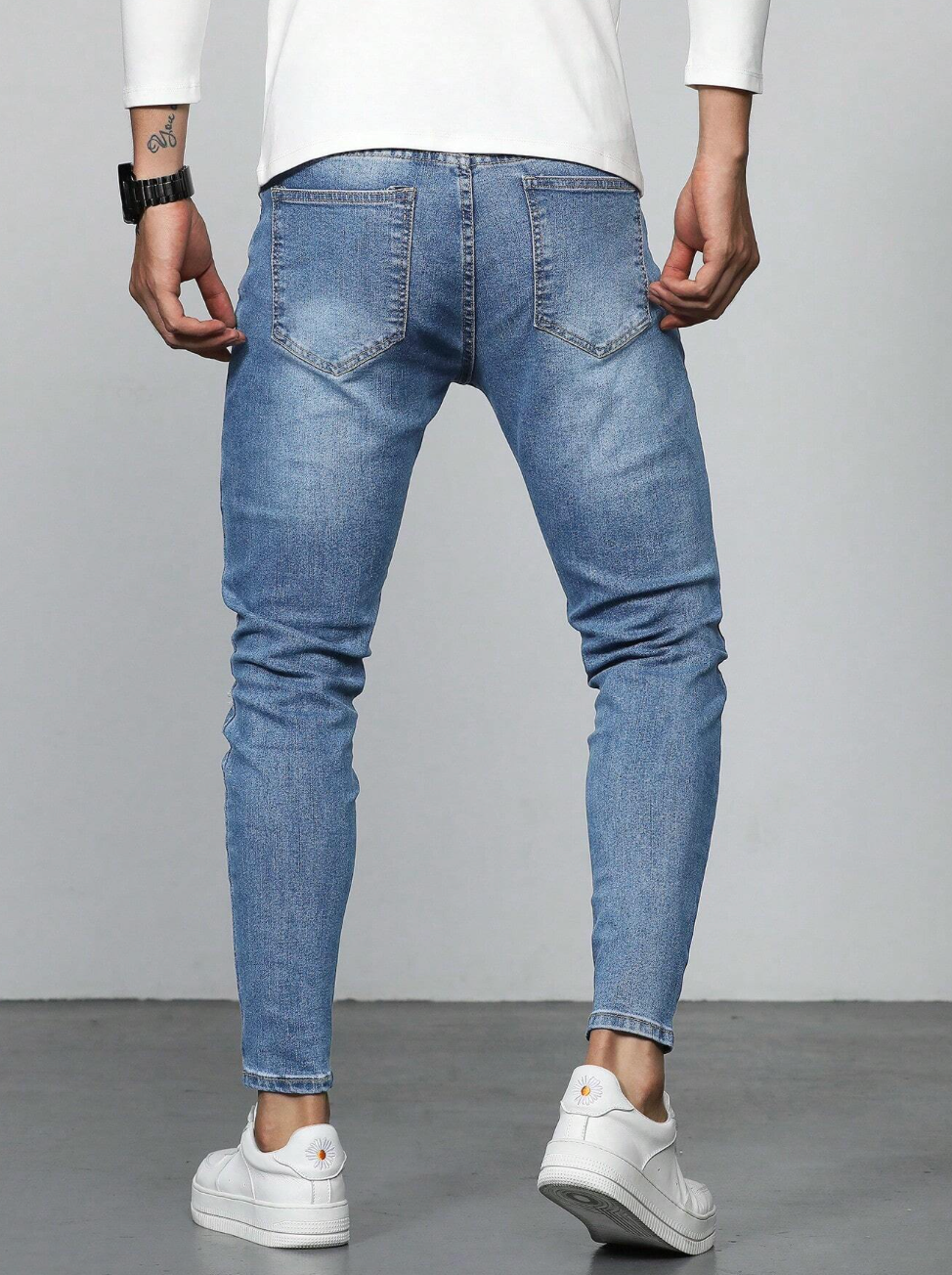 Jeans slim homme avec déchirures