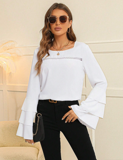 Blusa elegante con maniche svasate