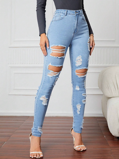 Jeans skinny a vita alta con strappi