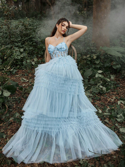 Robe de cérémonie longue avec corset à paillettes et ourlet à volants superposés